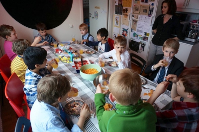 Everyone enjoying cake and snacks